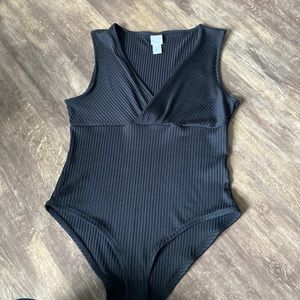 Never worn black body suit
